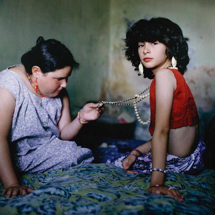 A photo of two person sitting.