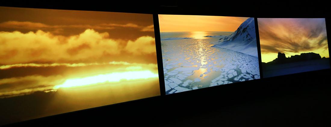 Installation view of “Vertigo Sea”, a three-channel video by John Akomfrah (UK).