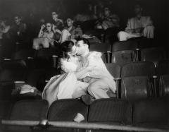 Weegee, [Woman and man kissing at movies, New York], ca. 1943. © Weegee/International Center of Photography