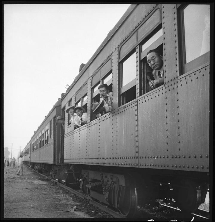 Japanese Americans being taken by train during WWII. 