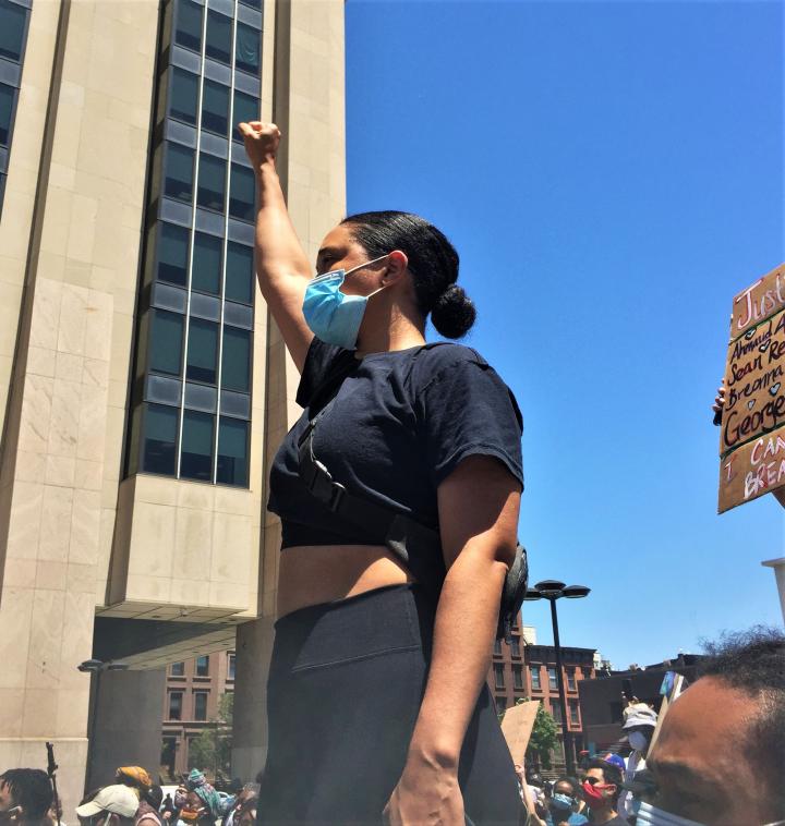 A girl standing tall and protesting