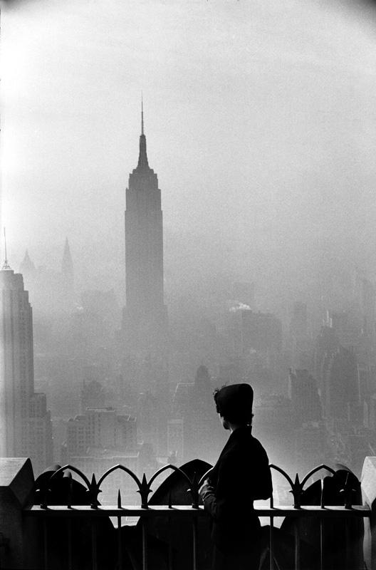 A person looking at the Empire State Building.