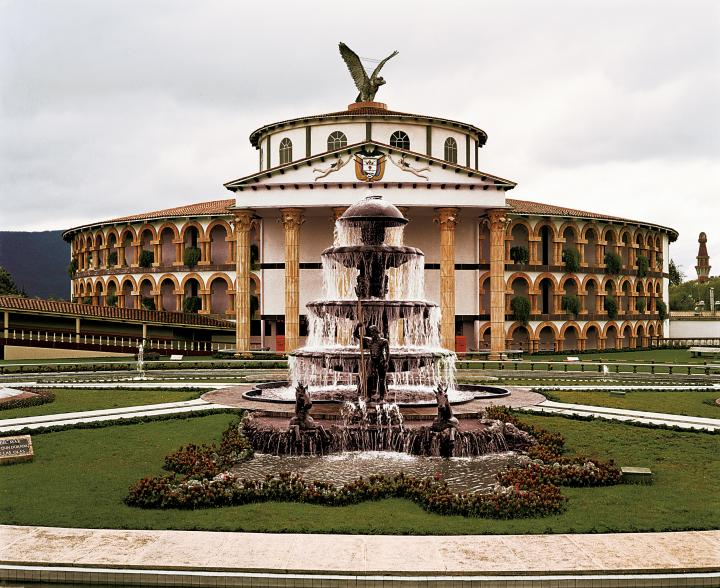 The font of a mansion with a water fountain in the center